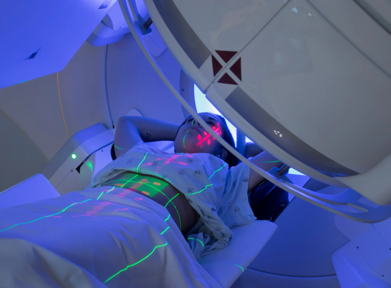 radiation patient on their back in a machine.